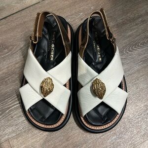 Kurt Geiger London white patent sandal with gold accents and black trim worn 1x